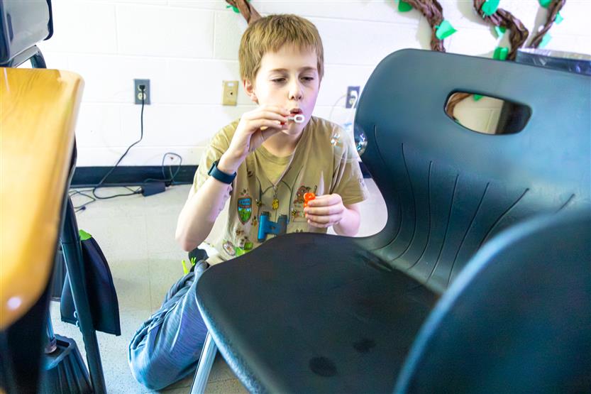 Elementary students doing a light lab
